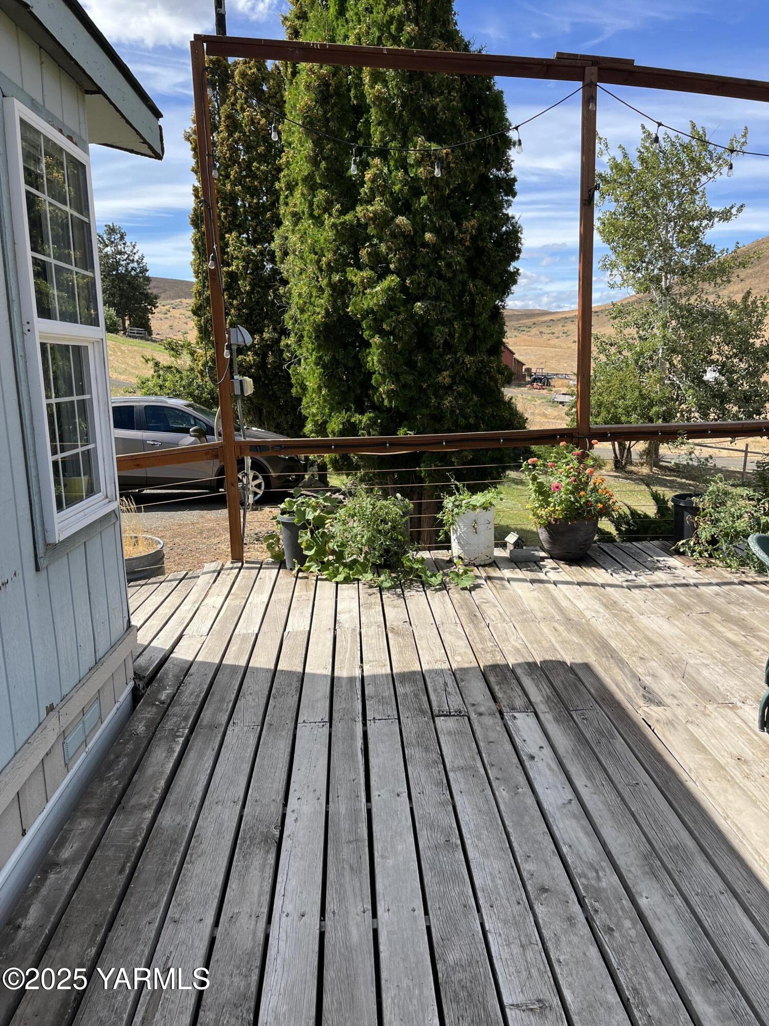 14190 North Wenas Road Selah, WA 98942 - Photo 53 of 62 a view of balcony with wooden floor and outdoor space