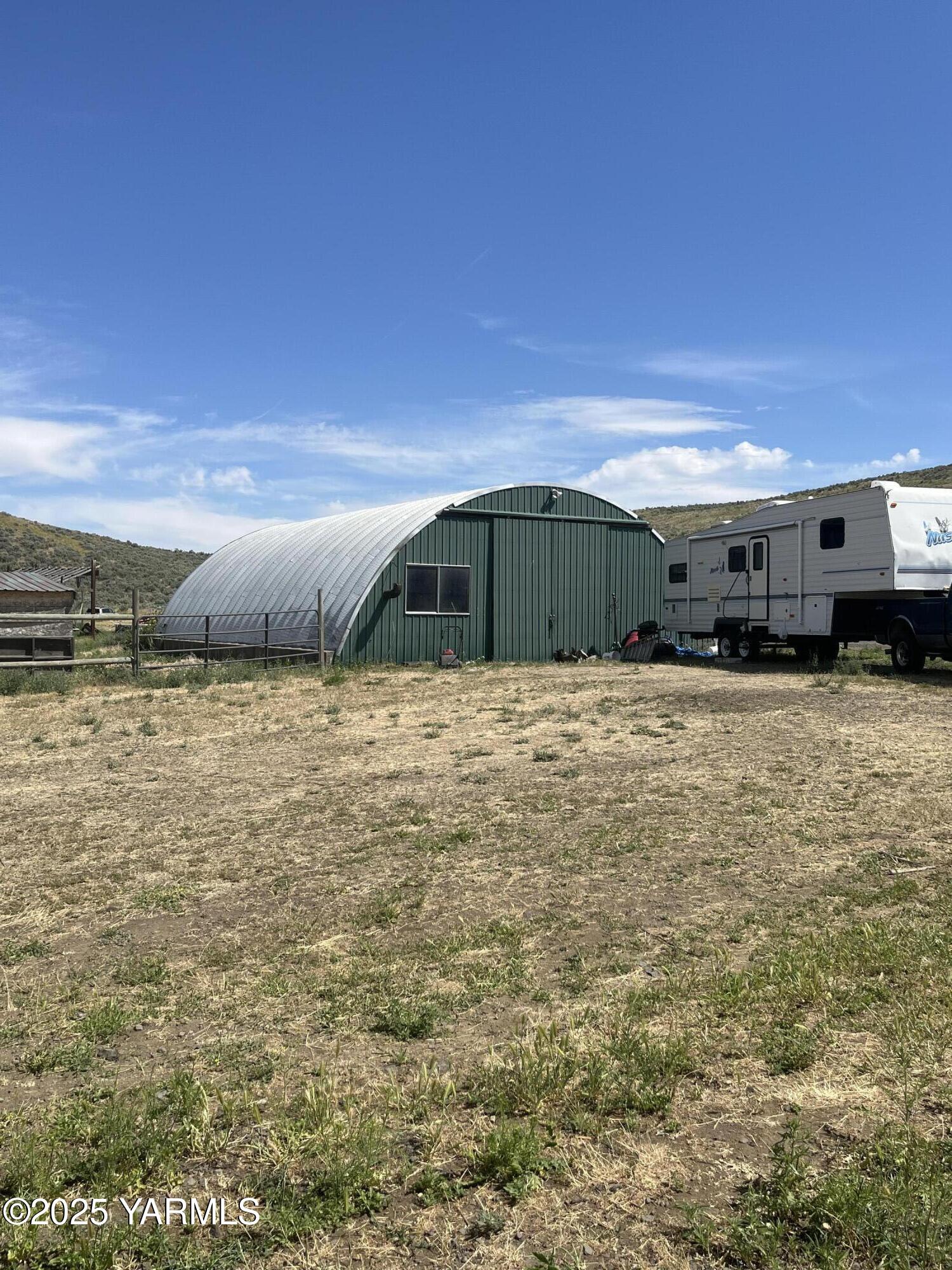 14190 North Wenas Road Selah, WA 98942 - Photo 7 of 62 a view of a house with a yard