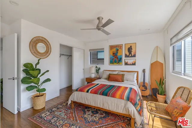 a bed room with furniture and wooden floor