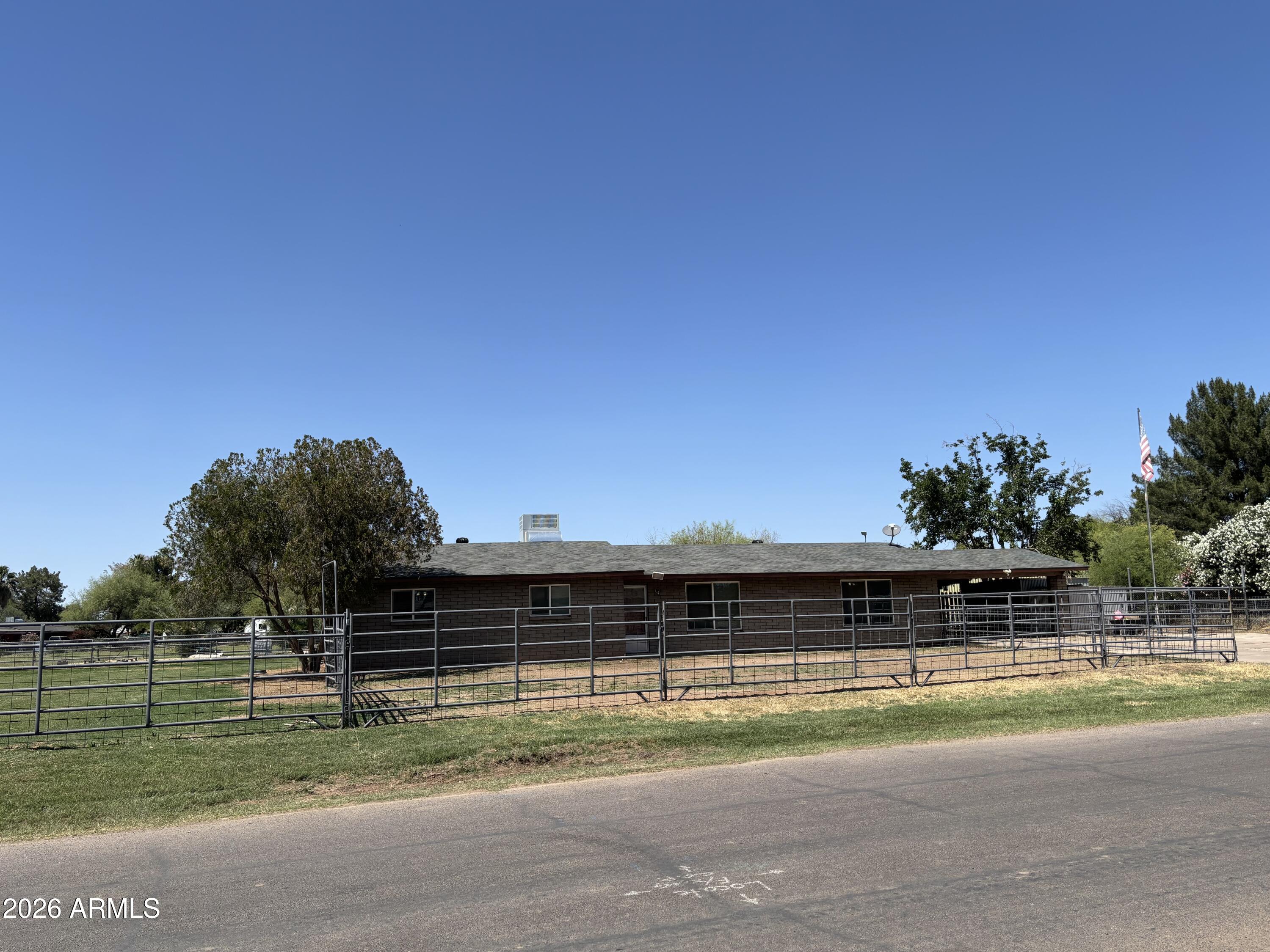 6508 West Fremont Road Laveen, AZ 85339 - Photo 1 of 32 a view of a swimming pool with an outdoor space and seating area