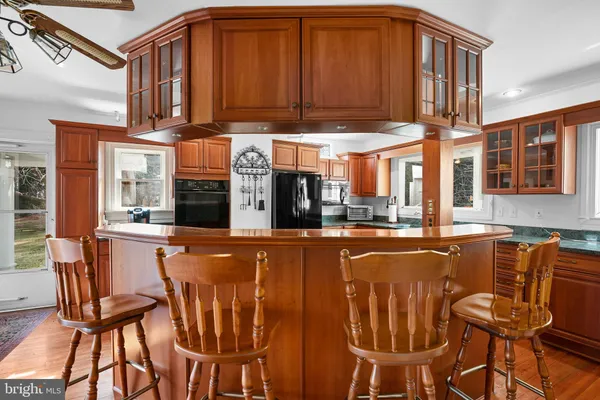 a view of an entryway with wooden floor and door