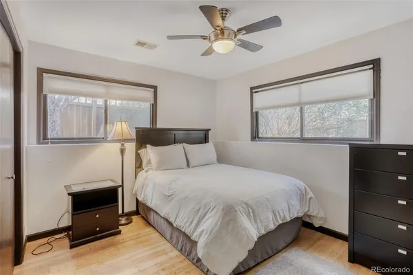 a bedroom with a large bed and a tv