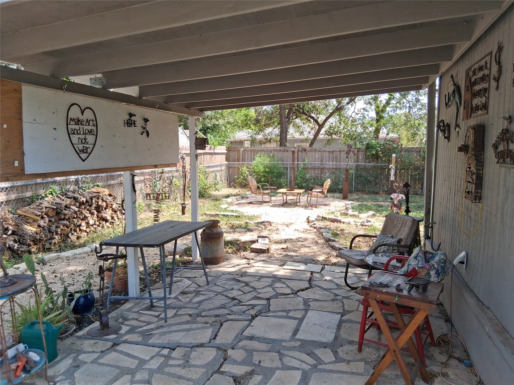 1115 Mark Street, Unit D Austin, TX 78721 - Photo 8 of 8 a outdoor living space with furniture and a large window