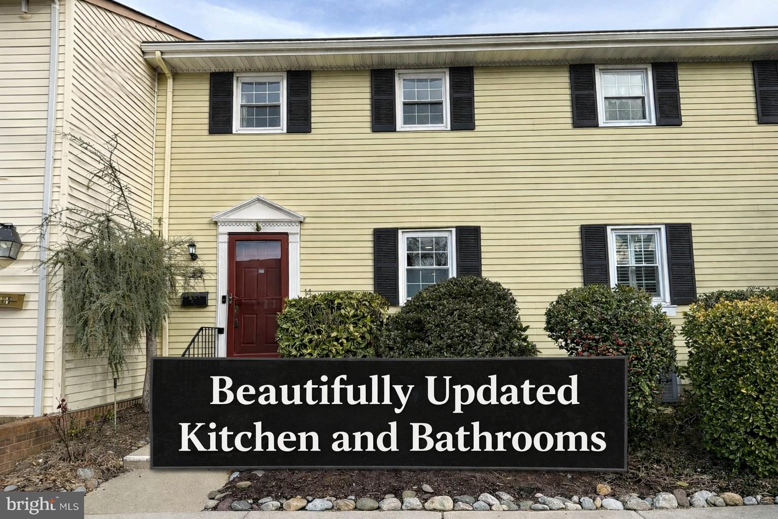 a view of a wooden house with a sign on the wall