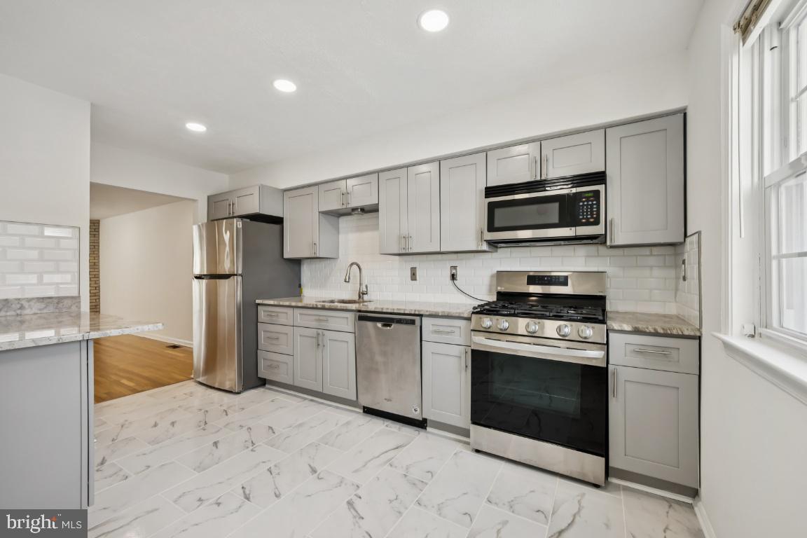 635 East Main Street, Unit 14 Moorestown, NJ 08057 - Photo 14 of 32 a kitchen with a sink stove and refrigerator