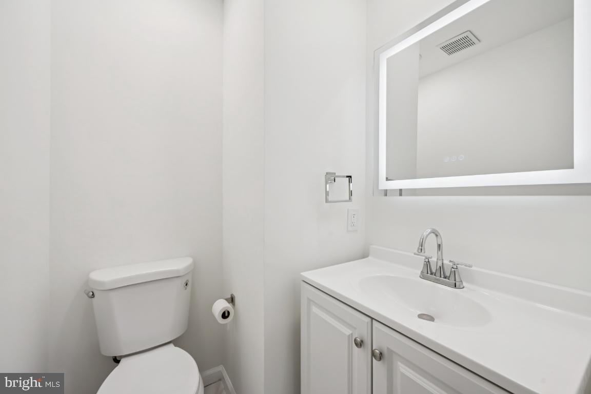 635 East Main Street, Unit 14 Moorestown, NJ 08057 - Photo 17 of 32 a white toilet sitting next to a bathroom sink