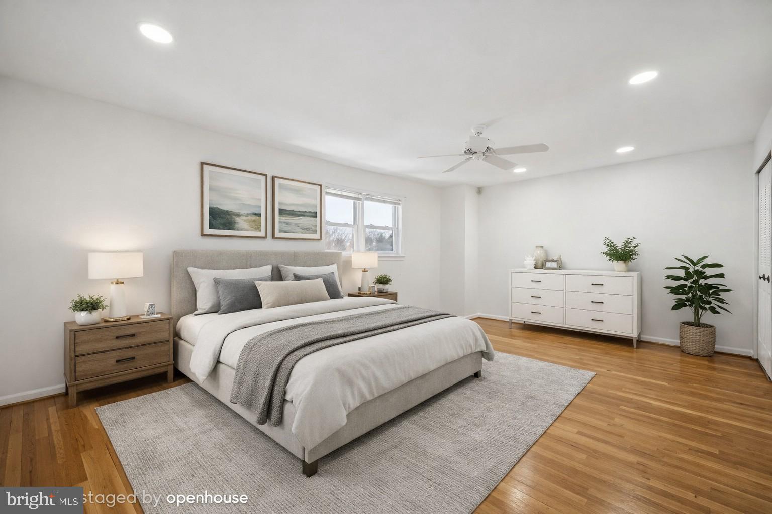 635 East Main Street, Unit 14 Moorestown, NJ 08057 - Photo 19 of 32 a spacious bedroom with a large bed and a chandelier