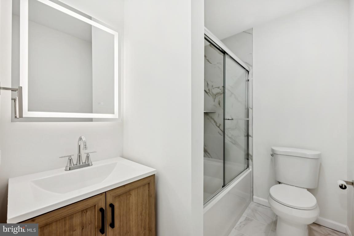 635 East Main Street, Unit 14 Moorestown, NJ 08057 - Photo 23 of 32 a bathroom with a sink toilet and shower