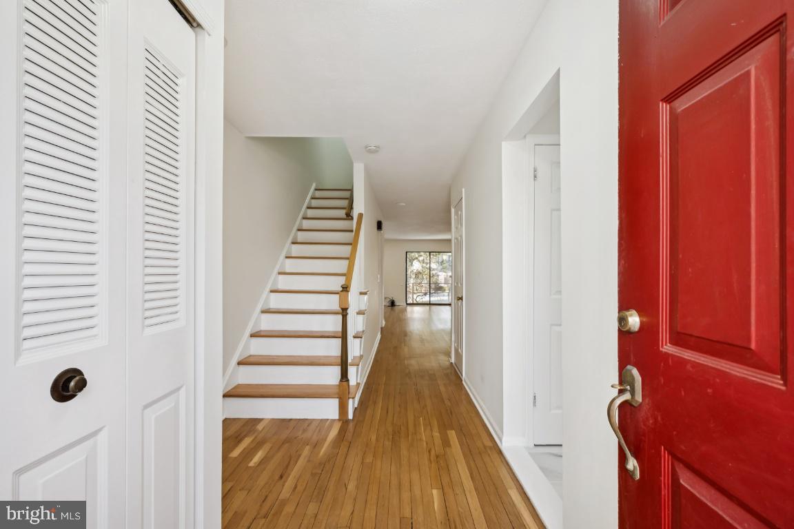 635 East Main Street, Unit 14 Moorestown, NJ 08057 - Photo 4 of 32 a view of a hallway with wooden floor and staircase