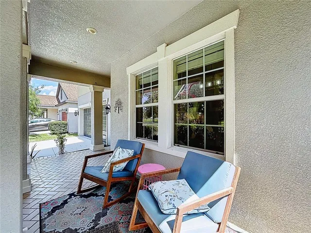 a vase of flowers sitting on a shelf