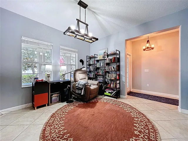 a vase of flowers sitting on a shelf