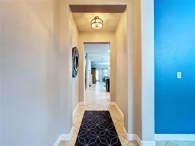 a bedroom with a bed and a ceiling fan