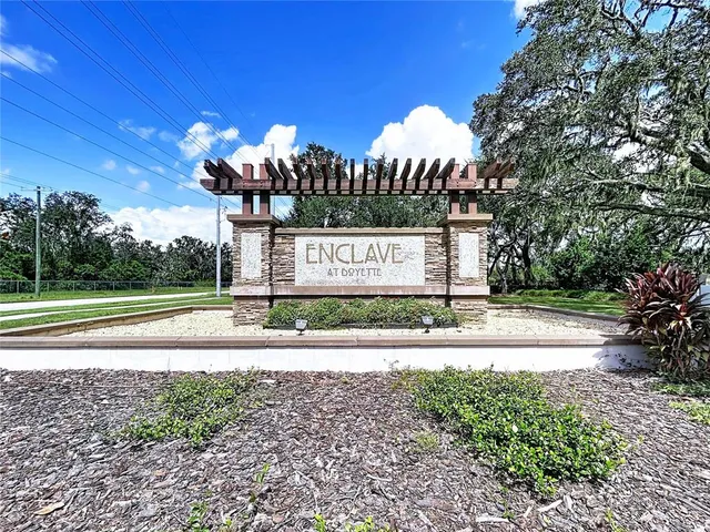 a kitchen with stainless steel appliances kitchen island granite countertop a sink and cabinets