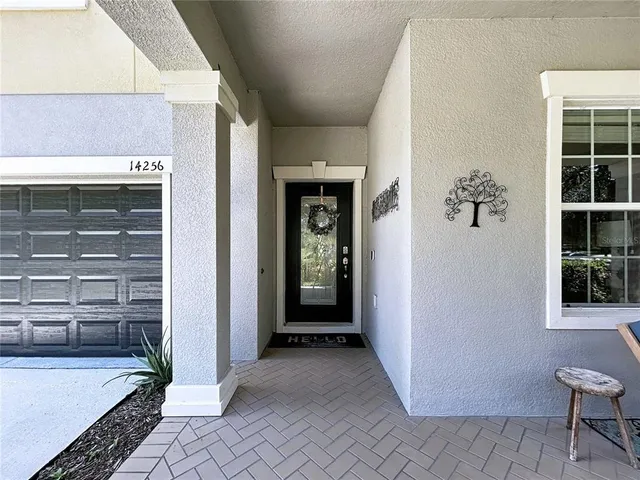 a kitchen with granite countertop a sink a counter top space appliances and cabinets