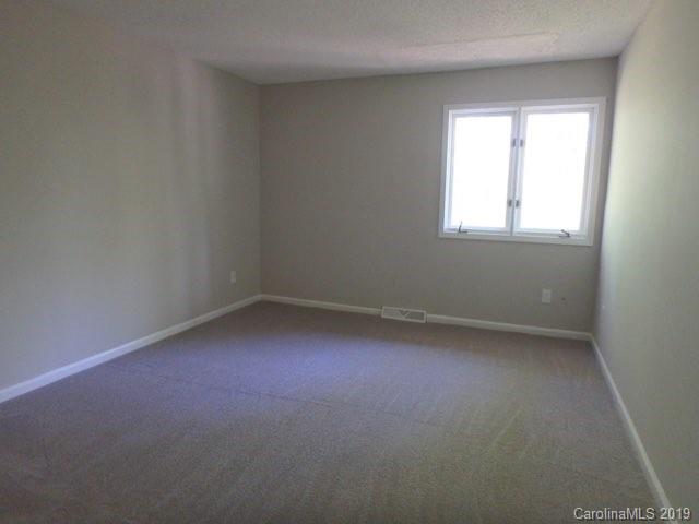 2343 Roland Drive, Unit D Monroe, NC 28110 - Photo 8 of 13 an empty room with a window