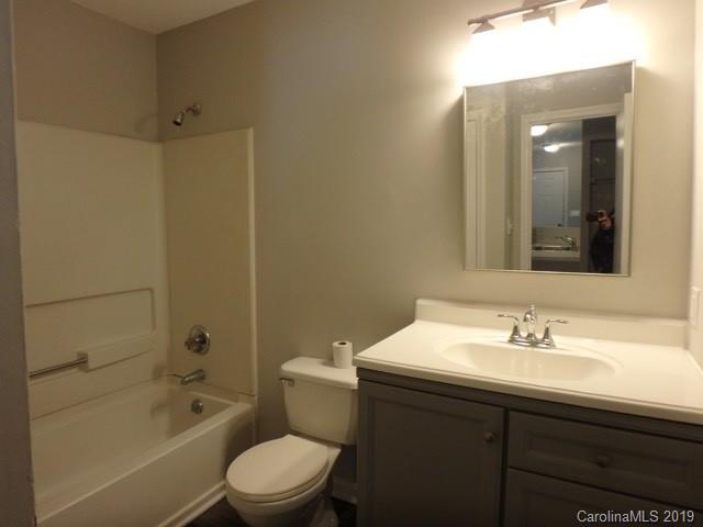 2343 Roland Drive, Unit D Monroe, NC 28110 - Photo 9 of 13 a bathroom with a sink a toilet and shower