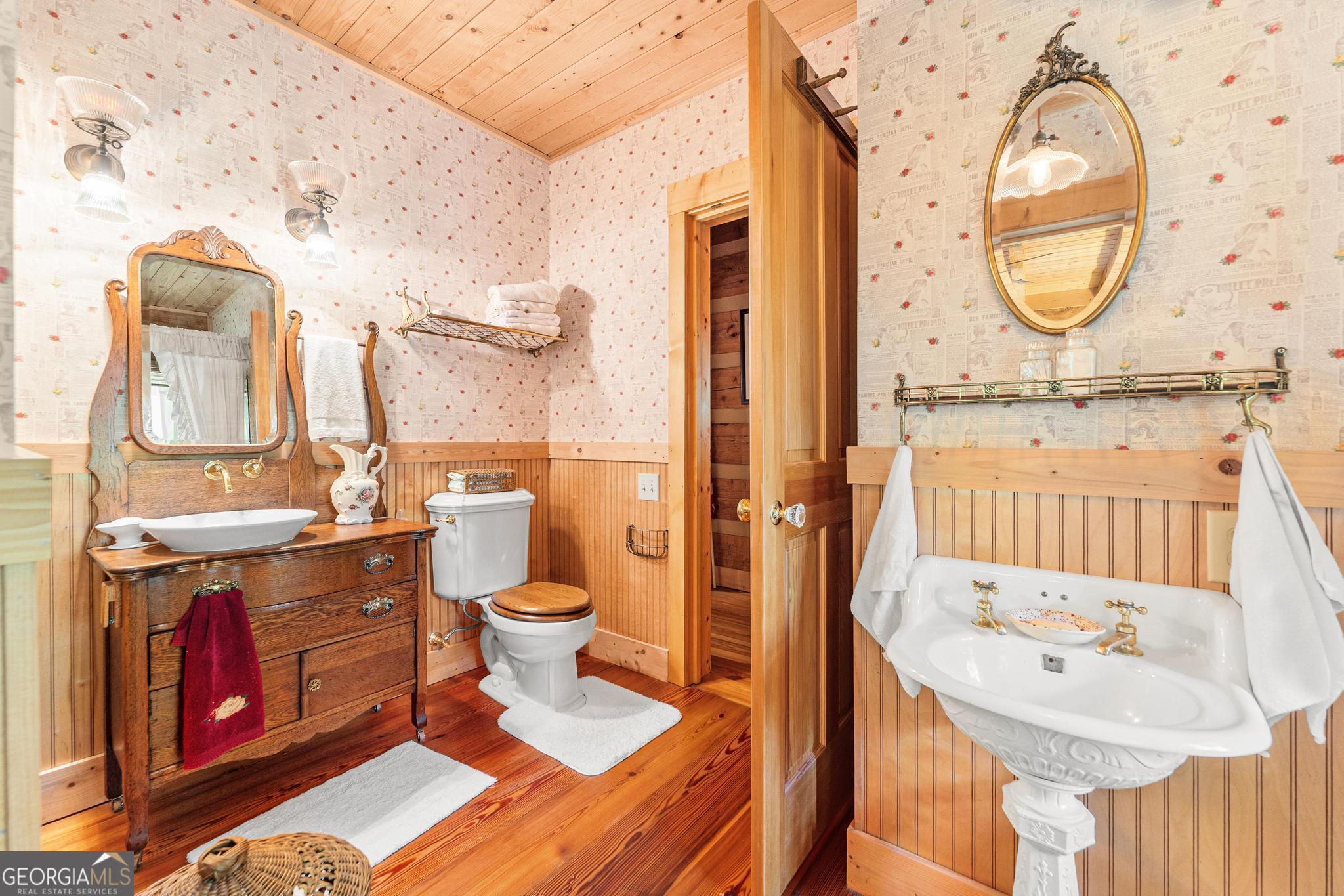 1127 Sautee Trail Sautee Nacoochee, GA 30571 - Photo 20 of 85 a bathroom with a sink a toilet and a mirror