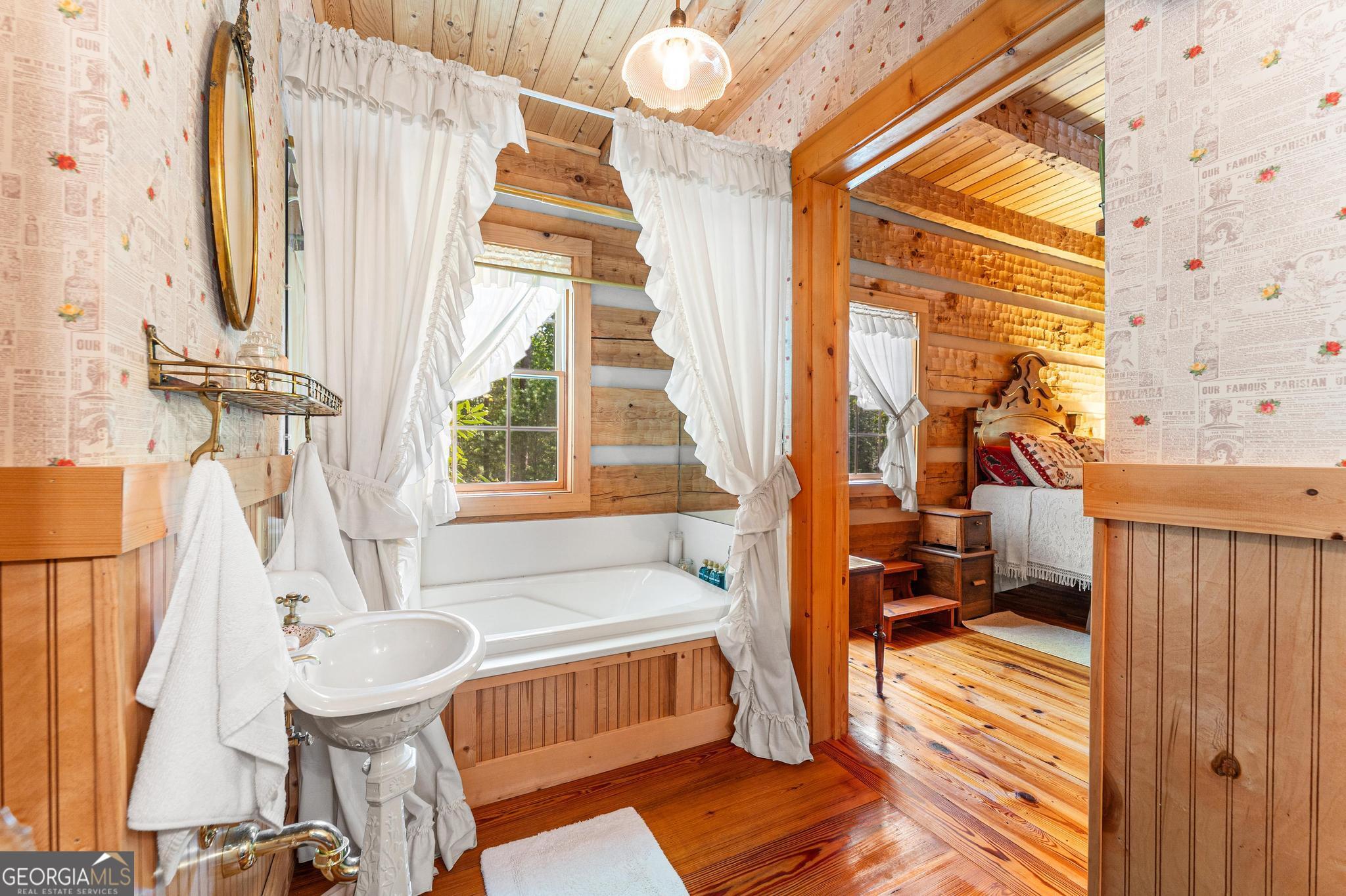 1127 Sautee Trail Sautee Nacoochee, GA 30571 - Photo 21 of 85 a living room with furniture and a floor to ceiling window