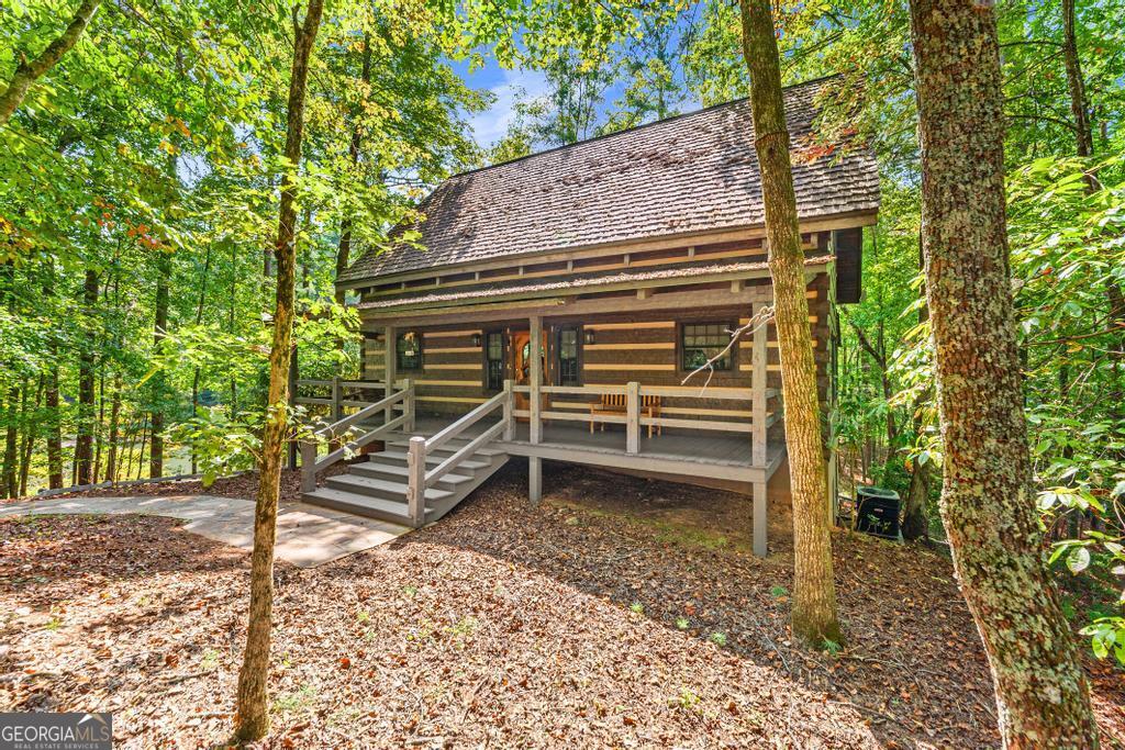 1127 Sautee Trail Sautee Nacoochee, GA 30571 - Photo 67 of 85 a front view of a house with a tree