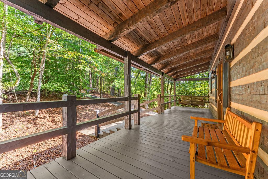 1127 Sautee Trail Sautee Nacoochee, GA 30571 - Photo 70 of 85 a view of a deck with wooden floor and outdoor seating