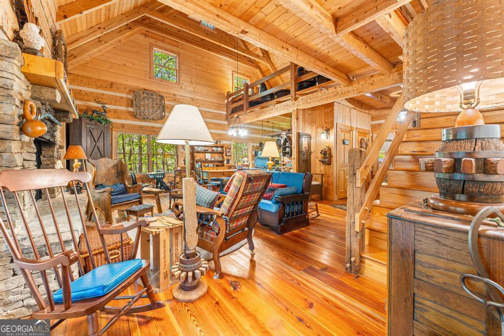 1127 Sautee Trail Sautee Nacoochee, GA 30571 - Photo 77 of 85 a view of a patio with table and chairs with wooden floor