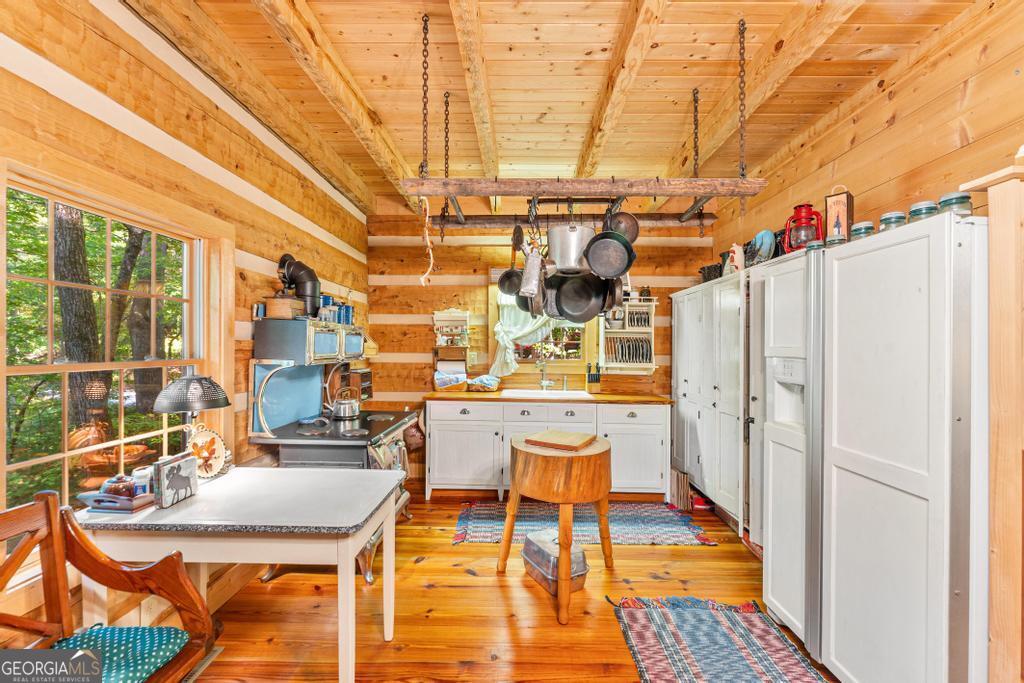 1127 Sautee Trail Sautee Nacoochee, GA 30571 - Photo 80 of 85 a dining room with furniture and wooden floor