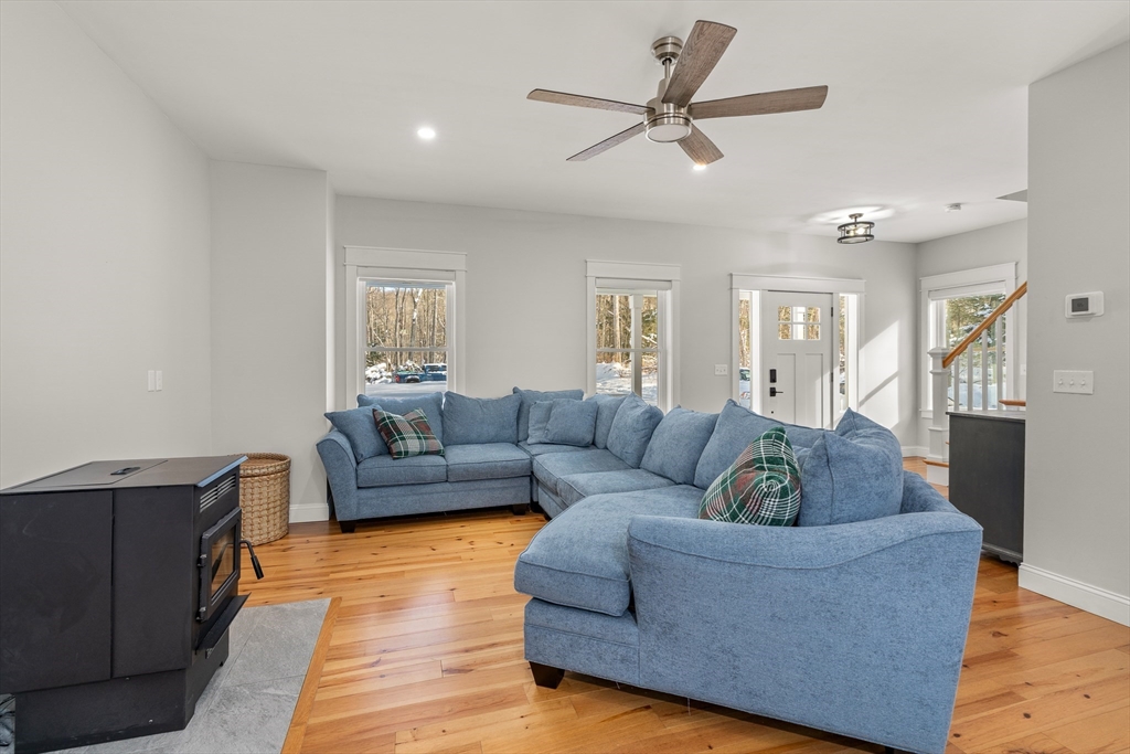 654 Skyline Trail Chester, MA 01011 - Photo 11 of 32 a living room with furniture and a view of kitchen