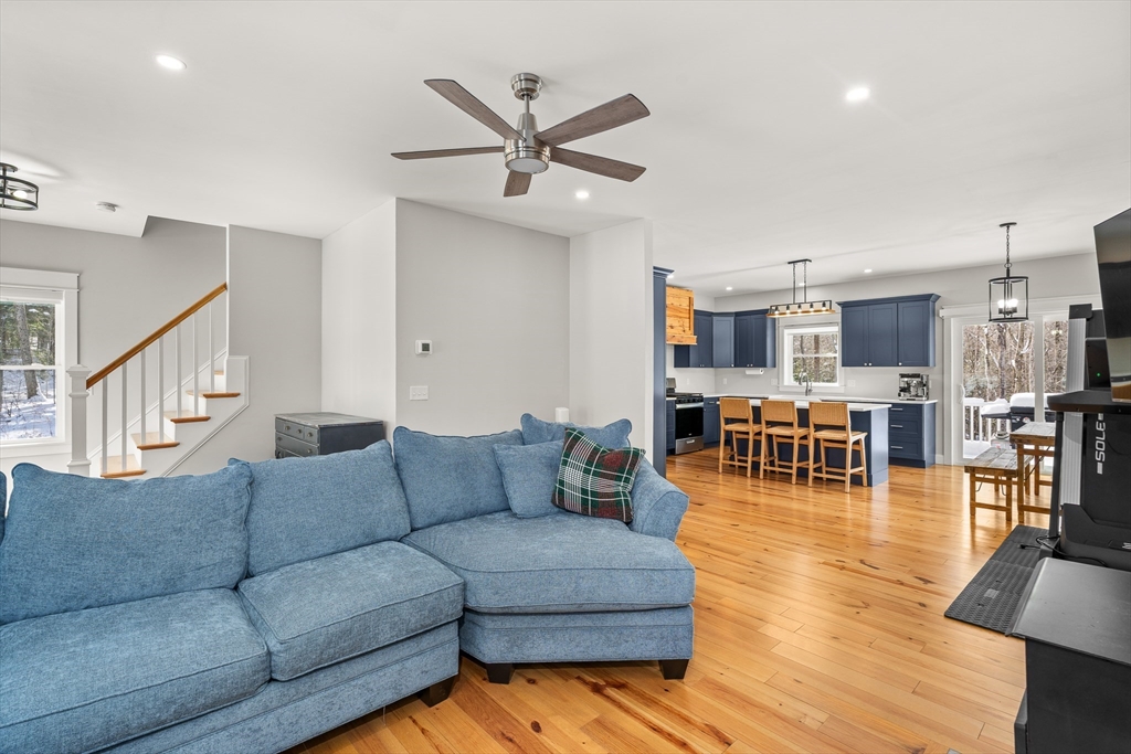 654 Skyline Trail Chester, MA 01011 - Photo 12 of 32 a living room with furniture and kitchen view with wooden floor