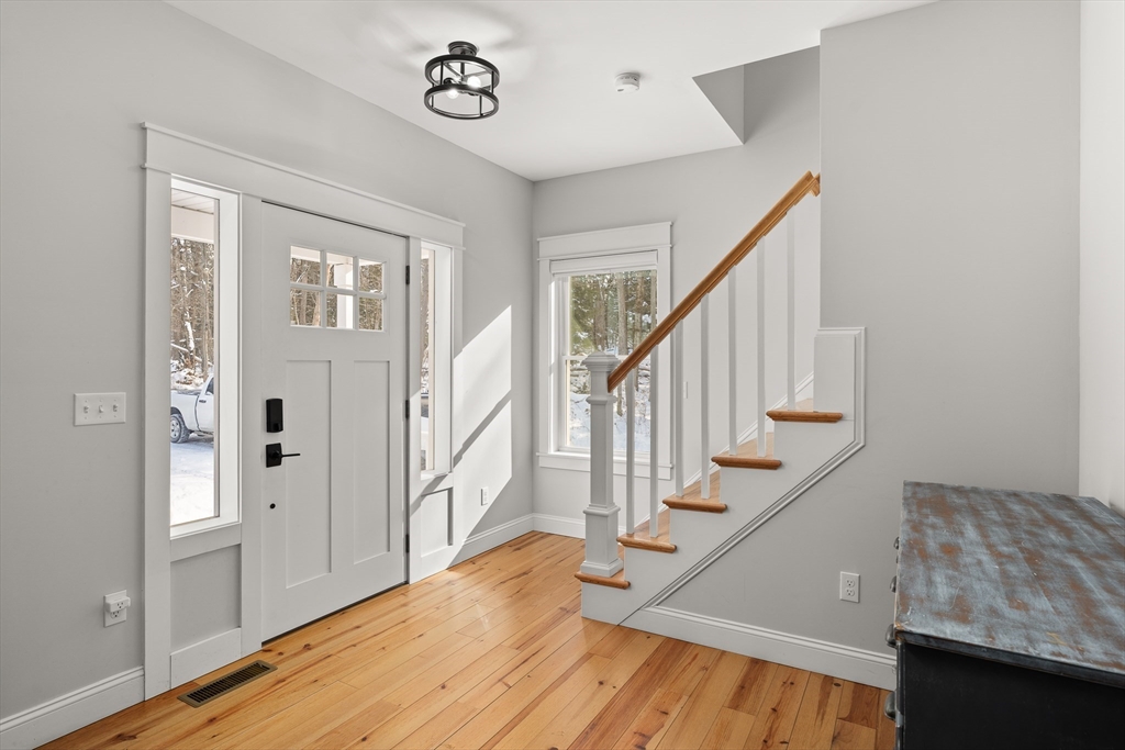 654 Skyline Trail Chester, MA 01011 - Photo 13 of 32 a view of entryway and hall with wooden floor