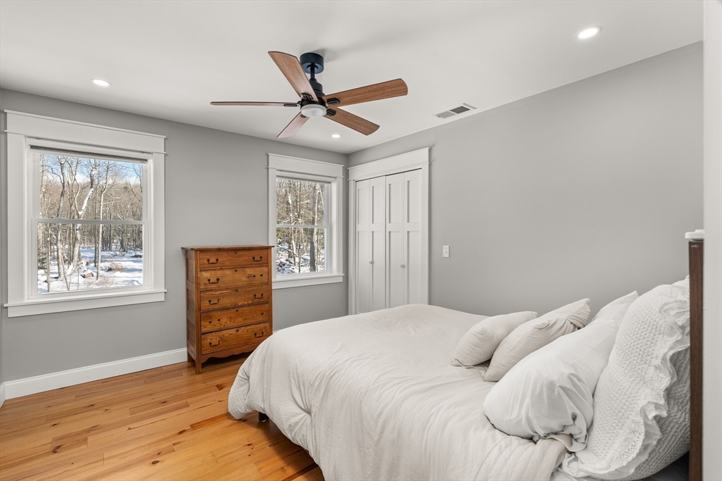 654 Skyline Trail Chester, MA 01011 - Photo 23 of 32 a bedroom with a bed and a window