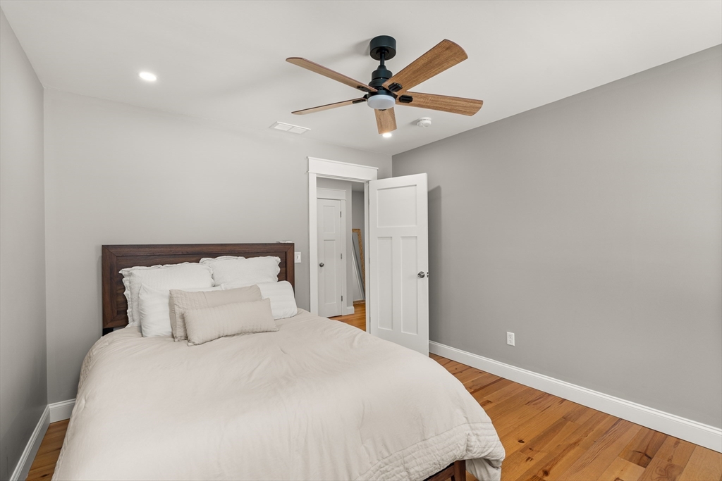 654 Skyline Trail Chester, MA 01011 - Photo 26 of 32 a bedroom with a bed and a ceiling fan