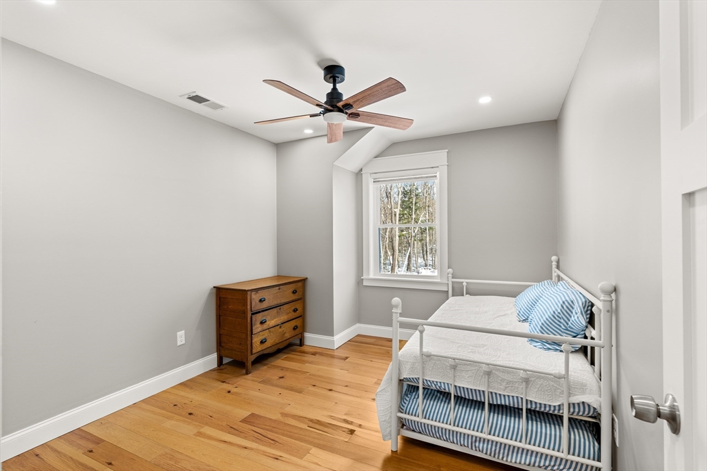 654 Skyline Trail Chester, MA 01011 - Photo 27 of 32 a bedroom with a bed and a window