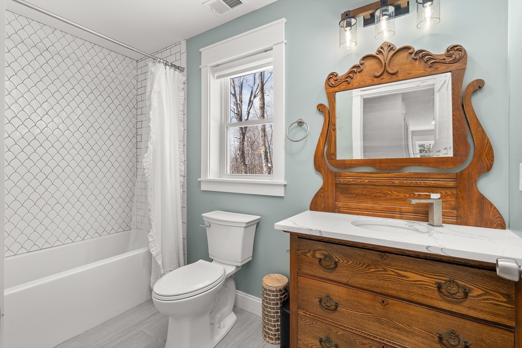 654 Skyline Trail Chester, MA 01011 - Photo 30 of 32 a bathroom with a toilet a sink and bathtub