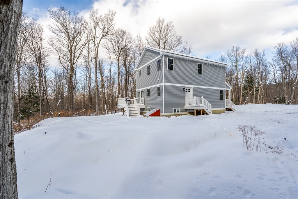 654 Skyline Trail Chester, MA 01011 - Photo 3 of 32 a view of white house with a big yard