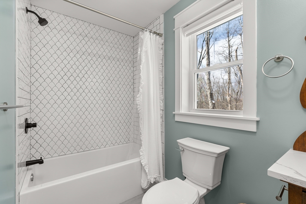 654 Skyline Trail Chester, MA 01011 - Photo 31 of 32 a bathroom with a toilet and a bathtub