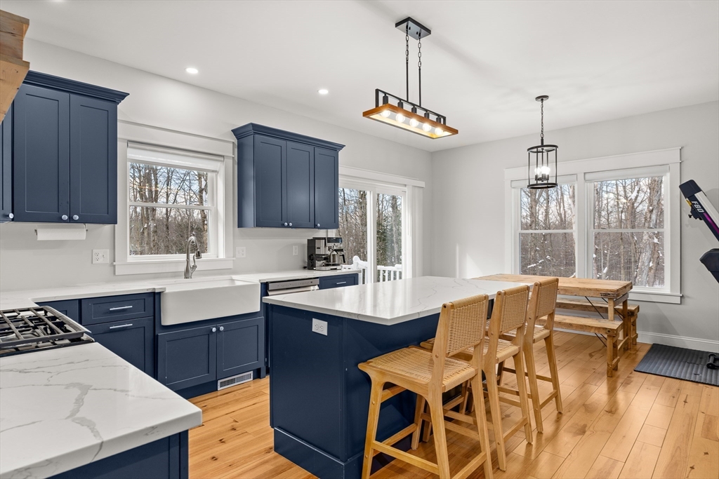654 Skyline Trail Chester, MA 01011 - Photo 6 of 32 a view of a dining room with furniture window and wooden floor