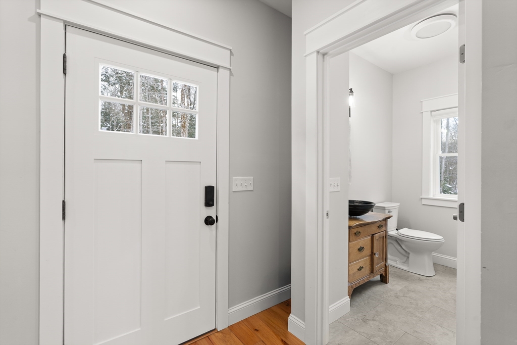 654 Skyline Trail Chester, MA 01011 - Photo 9 of 32 a bathroom with a toilet sink and a mirror