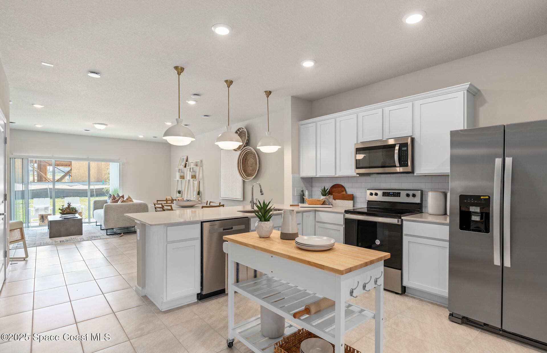 4317 Jetty Lane Palm Bay, FL 32905 - Photo 4 of 16 a kitchen with a sink a counter top stainless steel appliances and cabinets