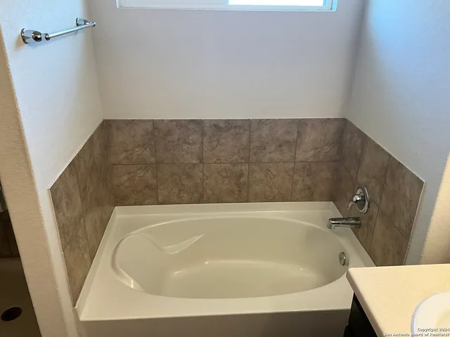 a bathroom with a bathtub