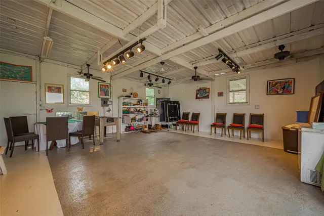 a view of a livingroom with furniture and a projector
