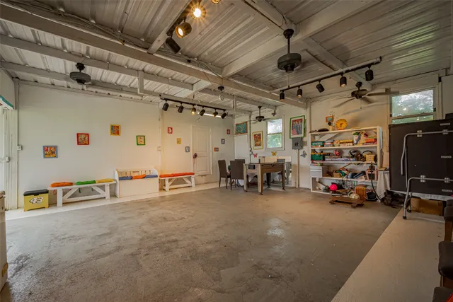 a view of parking garage with cars