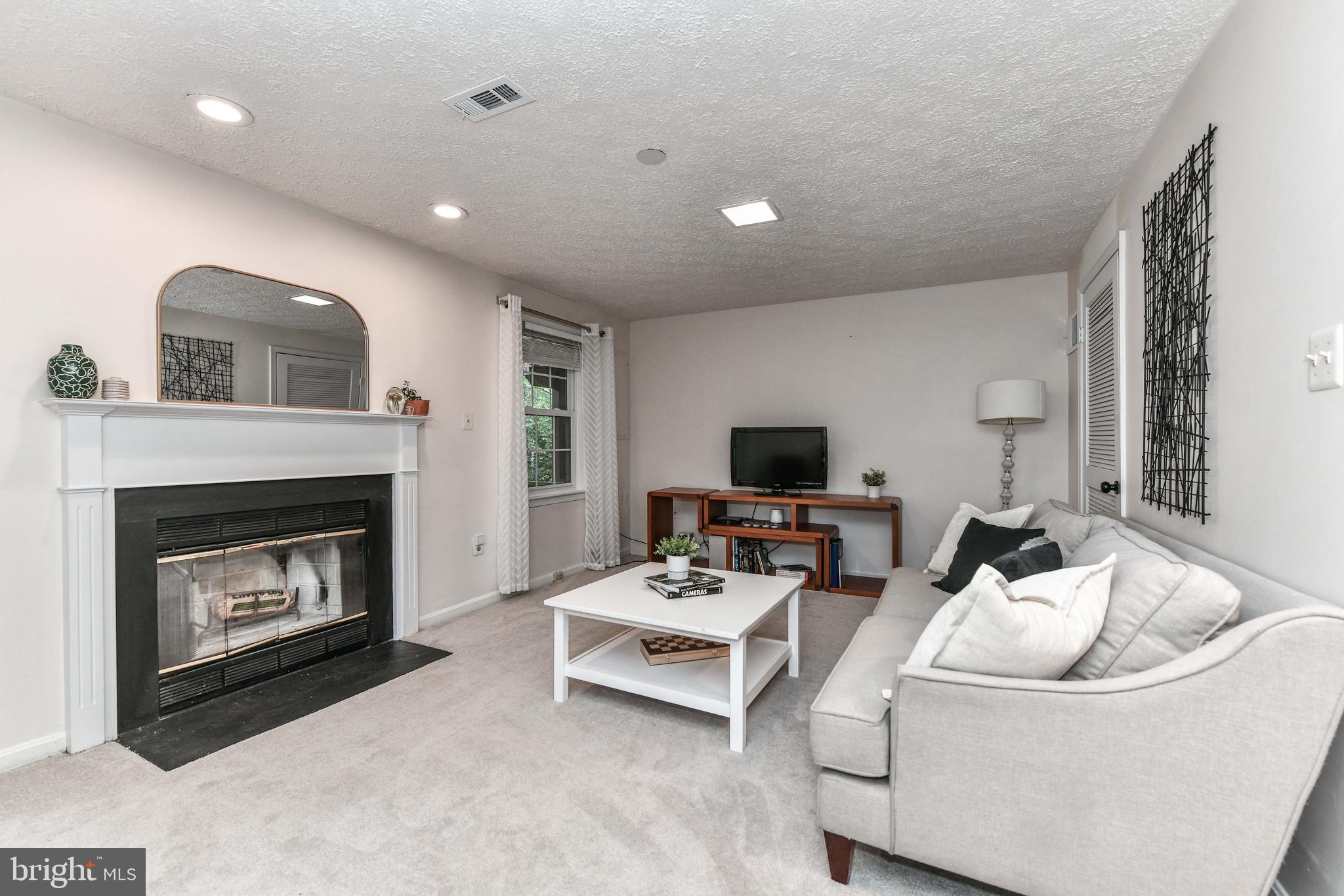 11790 Great Owl Circle Reston, VA 20194 - Photo 37 of 54 Living space/den in lower level w/ fireplace!