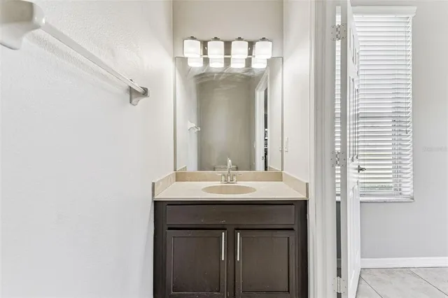 a bathroom with a sink and a mirror