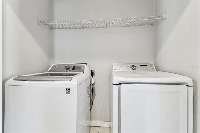 a view of a bathroom with a shower and closet