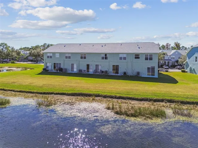 an aerial view of a house with outdoor space