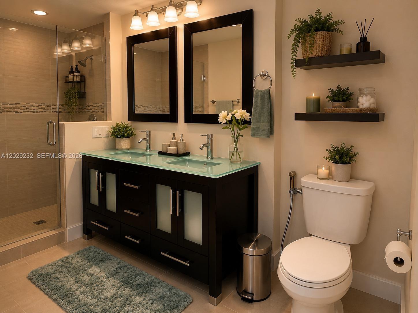 17100 North Bay Road, Unit 1605 Sunny Isles Beach, FL 33160 - Photo 23 of 52 a bathroom with a toilet a sink and mirror