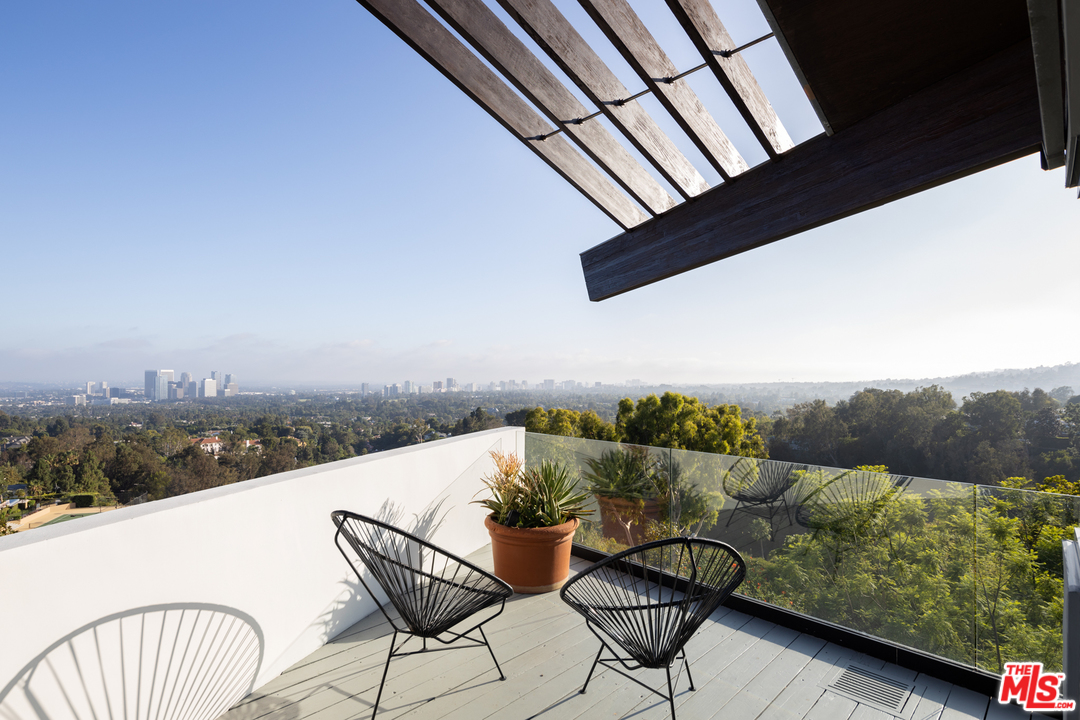 1375 Summitridge Place Beverly Hills, CA 90210 - Photo 12 of 21 a terrace view with seating space