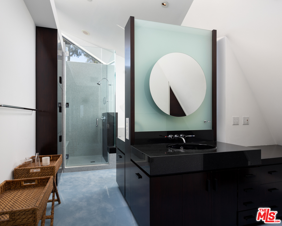 1375 Summitridge Place Beverly Hills, CA 90210 - Photo 13 of 21 a bathroom with a sink and a mirror