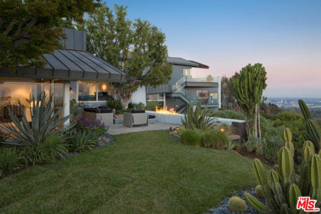 1375 Summitridge Place Beverly Hills, CA 90210 - Photo 15 of 21 a view of patio with table and chairs under an umbrella