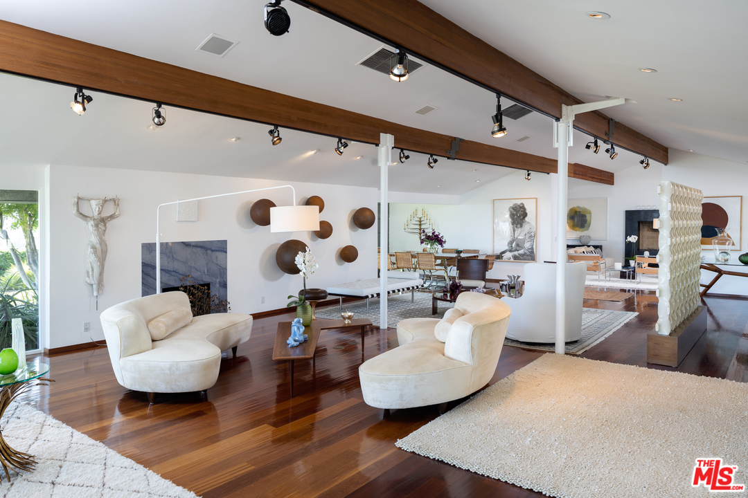 1375 Summitridge Place Beverly Hills, CA 90210 - Photo 3 of 21 a living room with furniture and wooden floor